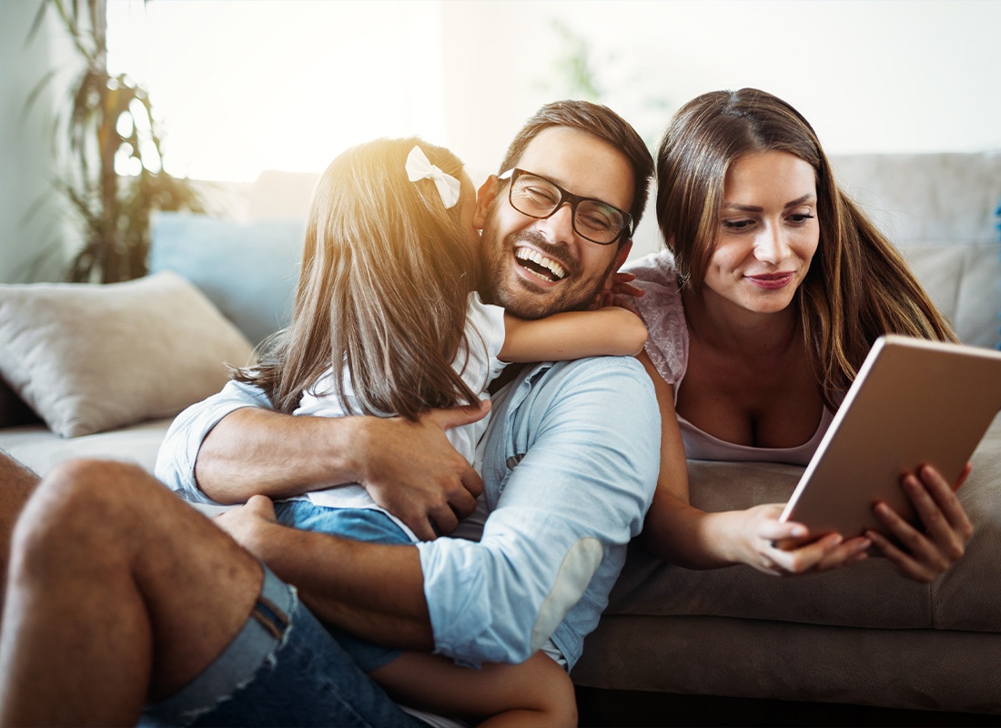 Personal Insurance - Happy Family Having a Fun Time at Home in Their Living Room