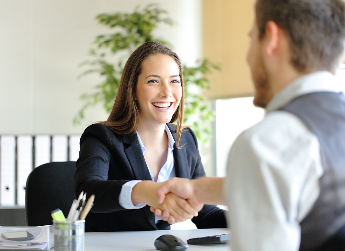 Read Our Reviews - Businesspeople Shaking Hands and Smiling After a Successful Meeting With Each Other